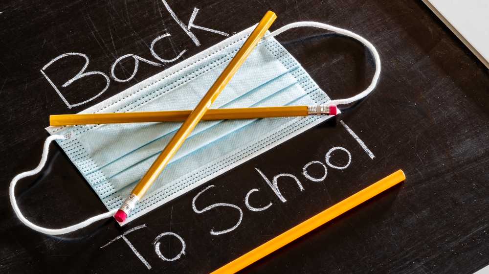 Back to school message with pencils making an x over a mask | 100 Seattle Students Walk Out To Protest End of Mask Mandate | 100 Seattle Students Walk Out To Protest End of Mask Mandate