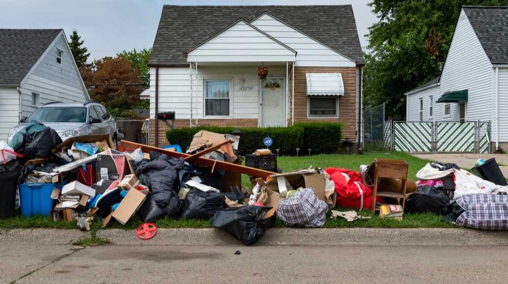 Belongings of an evicted person in front of a house-American Foster Kids Kicked Out of Foster Home For Migrant Children-ss-Featured
