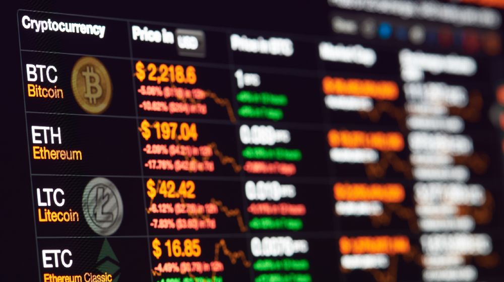 Bitcoin exchange to dollar rate on monitor display. Cryptocurrency invest chart | Can I Create My Own Cryptocurrency? | featured