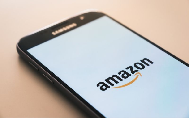 Black Samsung Galaxy Smartphone Displaying Amazon Logo | Consumer Watchdog Group Accuses Amazon of Price Gouging – with Markups from 76% to More Than 1,000%