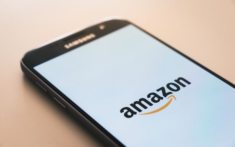 Black Samsung Galaxy Smartphone Displaying Amazon Logo | Amazon Brings Back Policy That Penalizes Employees for Taking Long Breaks