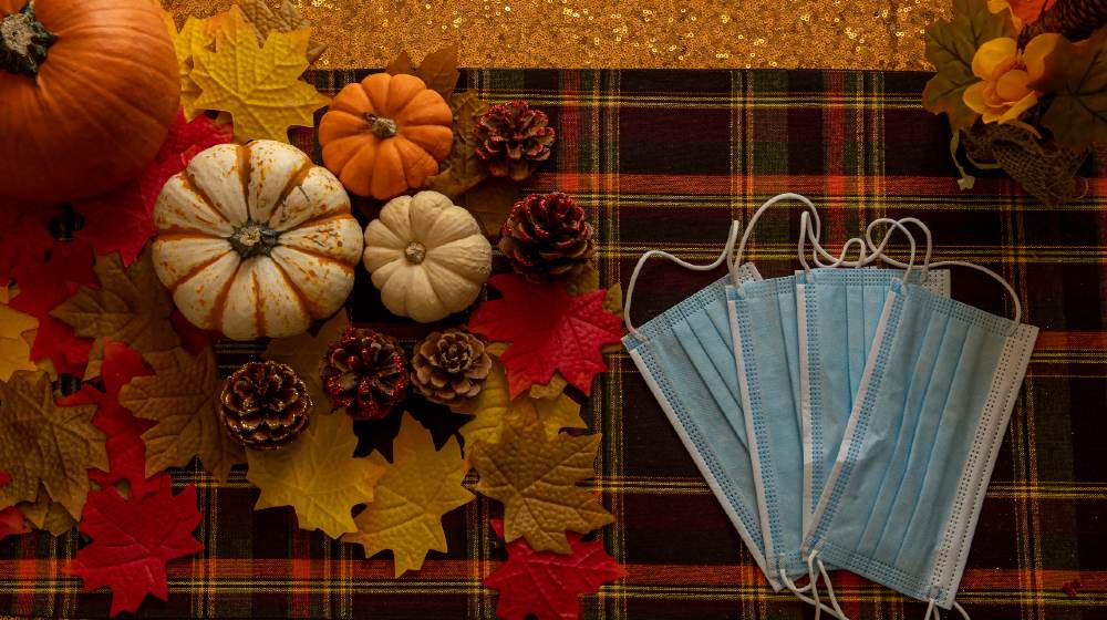 COVID Thanksgiving celebration with masks and pumpkins-Post Thanksgiving COVID-19 Surge-ss-featured