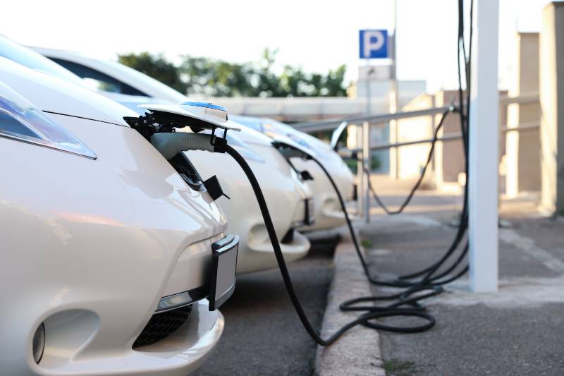 Charging modern electric cars from station outdoors | EV stations