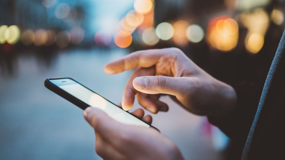 woman using her smartphone | 1 Million People in Seattle Area Will be First to Vote With Their Smartphones | Featured