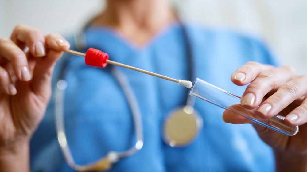 Buccal cotton swab and test tube | US to Start Collecting DNA From People Detained at Border | Featured