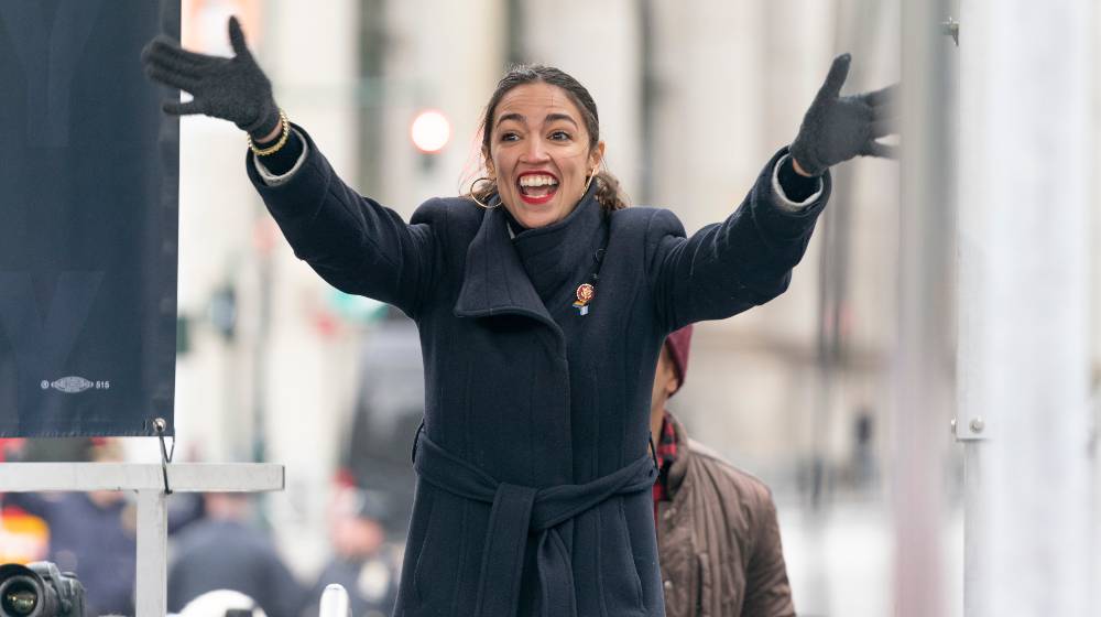 Congresswoman Alexandria Ocasio-Cortez attends Women's Unity Rally | After Partying Maskless in Florida, AOC Tested Positive For COVID-19 | featured