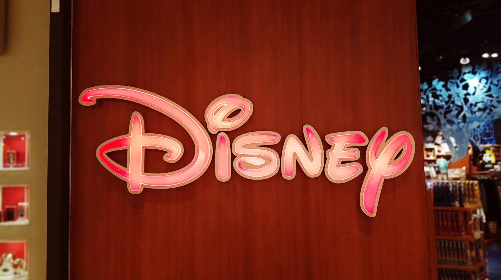 Disney Store sign outside retail outlet | Florida Will Owe Disney $1 Billion If It Removes Special Status | featured
