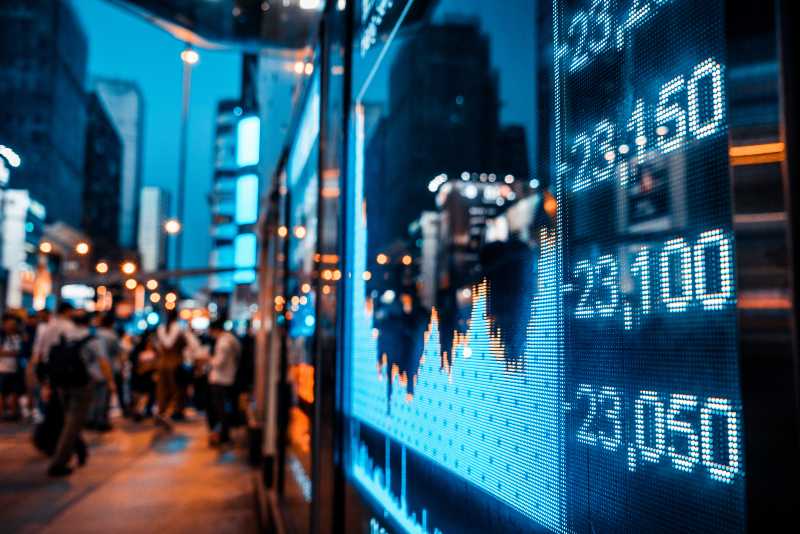 Display of Stock market quotes with city scene reflect on glass-Stock Prices