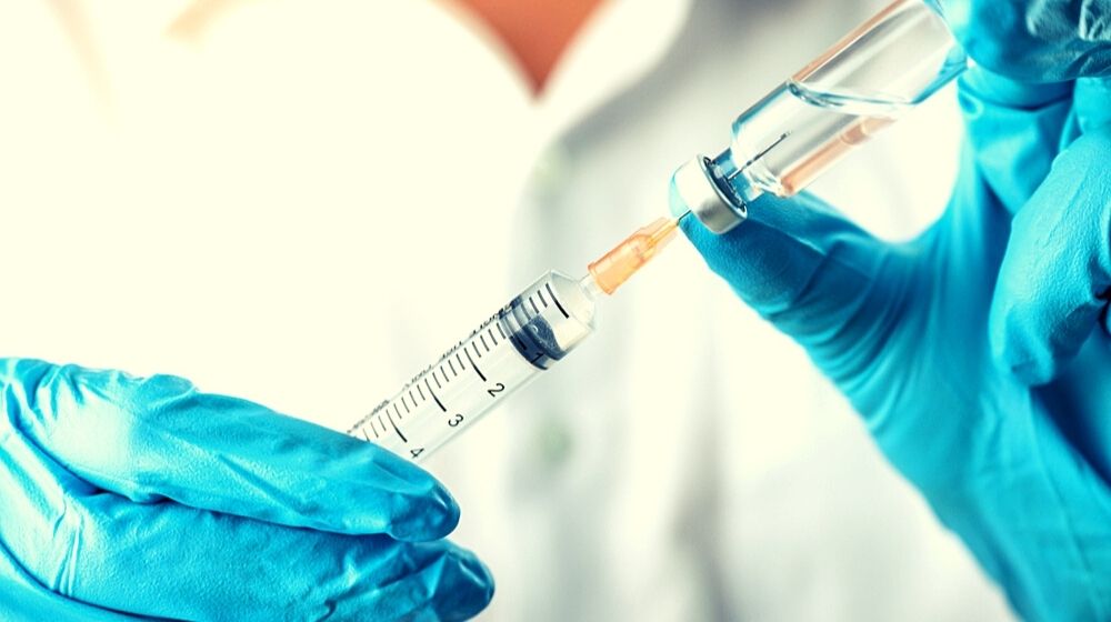 Doctor, Nurse, Scientist, Researcher Hand in Blue Gloves | First Coronavirus Vaccine to Be Tested in U.S. Boosts Participants’ Immune Systems | Featured