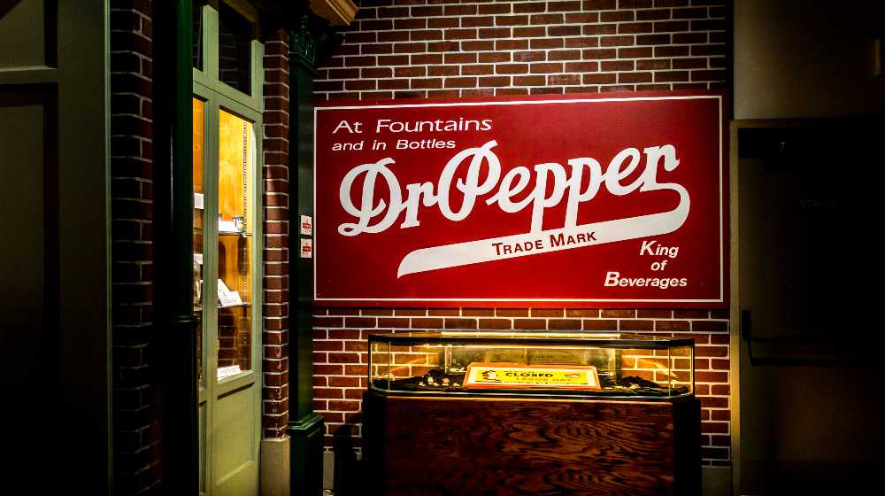 Dr.Pepper red sign on a brick wall | Sen. Kennedy: More People Trust Dr. Pepper Than Dr. Fauci | featured