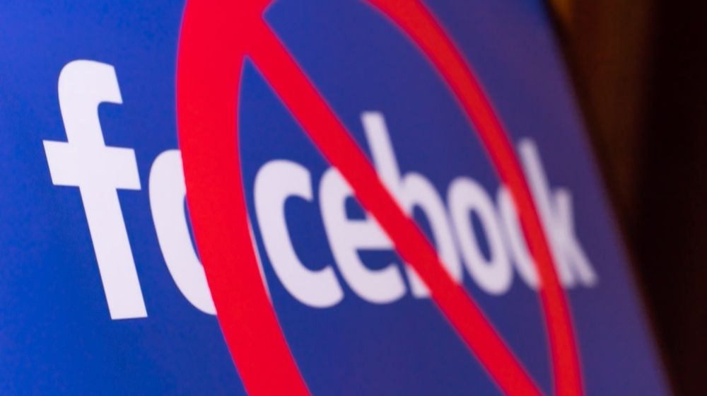 Facebook logo with a red circle on a monitor-Facebook Lifts Permanent Ban on Gun Rights Groups, Says It Is an 'Enforcement Error'-ss-Featured