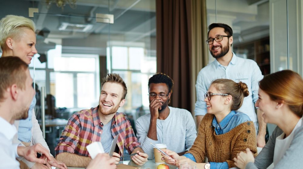 Group of People in a Workplace | Easy Ways to Bring Wellness into the Workplace | Featured