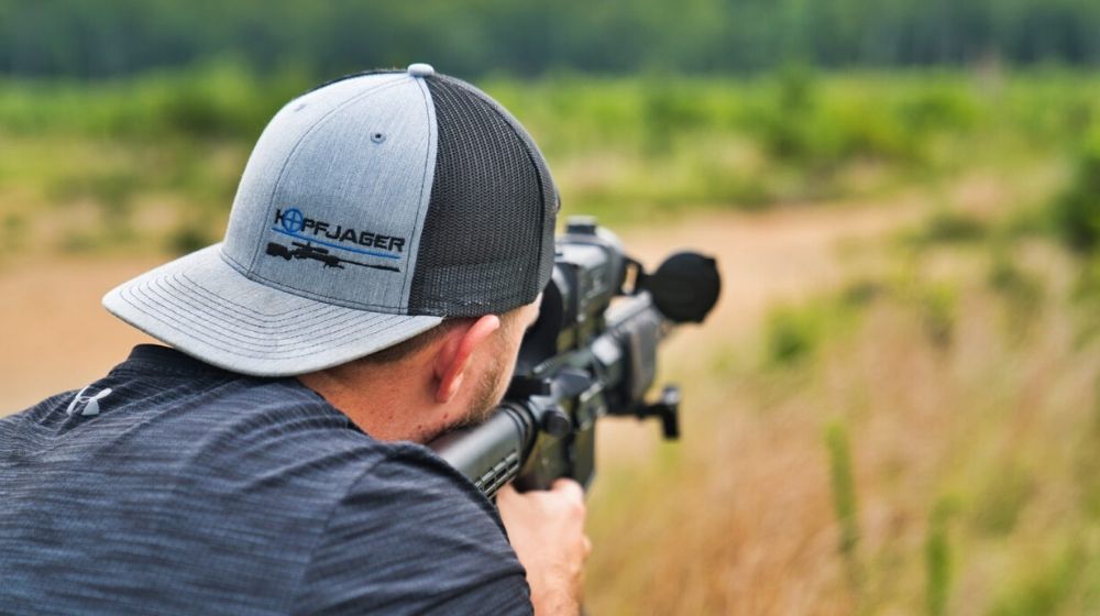 shallow focus photo of man holding a rifle | Grant County to Become Second Amendment Sanctuary | Featured