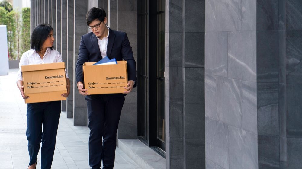 Male and Female Carrying their Box | COVID-19 Pandemic Amplifies That College Graduates Are More Likely to Be Protected from Unemployment | Featured