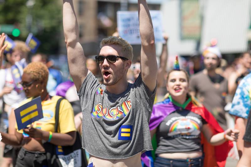 Man carries sign that says, Don't just hope for equality | What the 