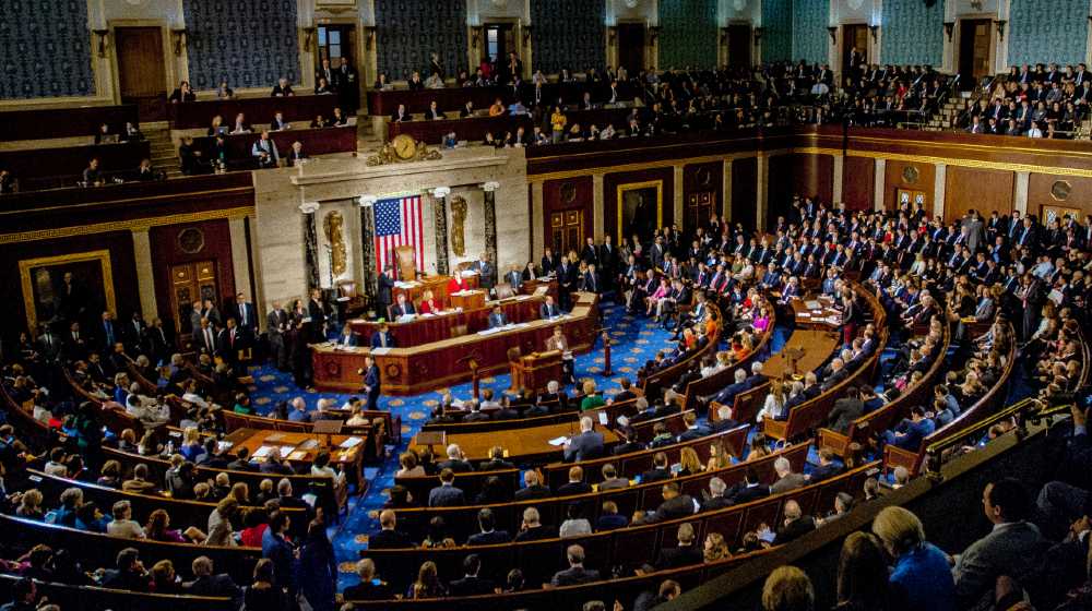 Members of the 115th congress and their familes mingle on the house floor while attending the joint session on the opening day of the current session-$2000 Stimulus-ss-featured