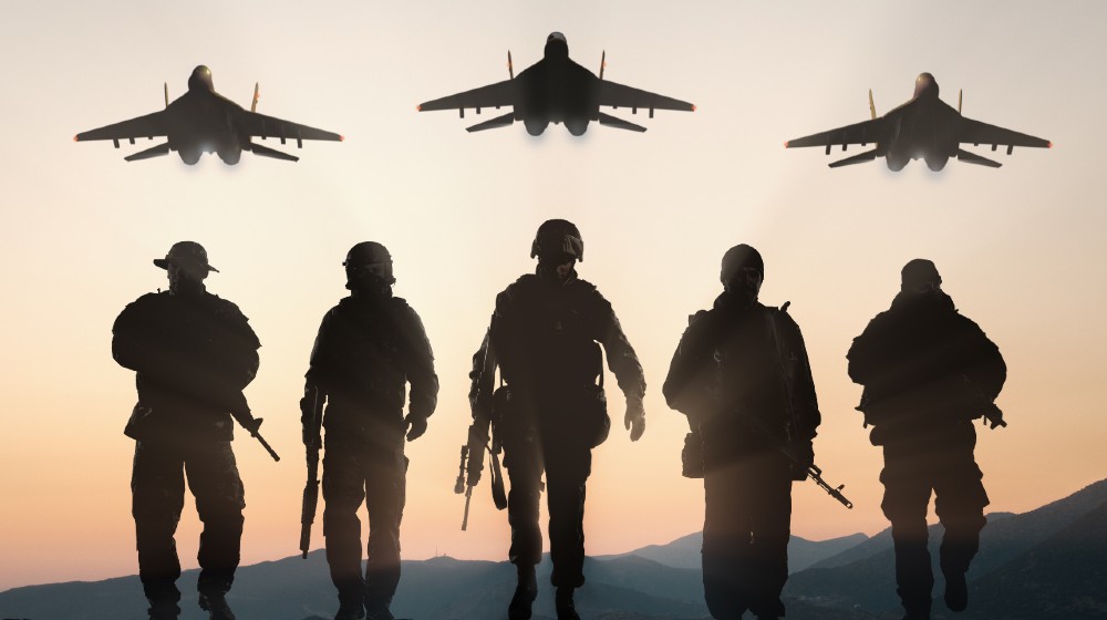 Military silhouettes of soldiers and airforce against the backdrop of sunset sky | All US Troops In Afghanistan Will Be Home by Sept 11 | Featured