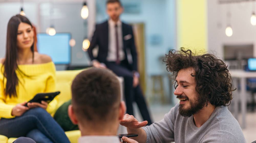 Multiethnic group of employees working in a google environment company | Google Will Fire All Its Unvaccinated Employees By Next Year | featured