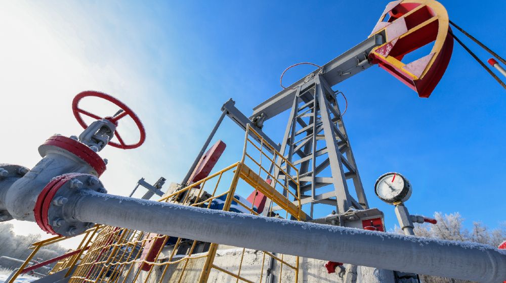 Oil pumpjack winter work. Oil pressure gauge shows 10 ATM-Texas Freezes-ss-featured