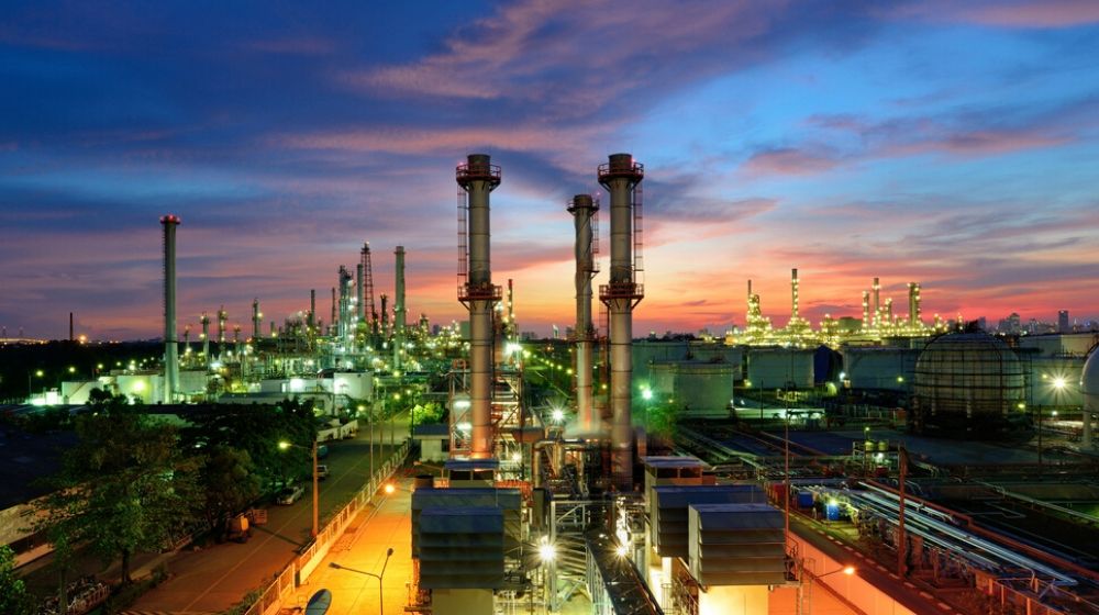 oil refinery twilight | Russians, Saudis Agree to Cut Crude Production | Featured