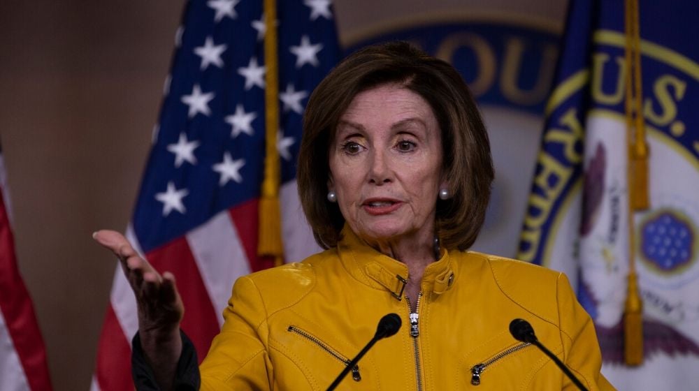 Pelosi in yellow | Pelosi Sets Medicare Showdown on Drug Costs | Featured