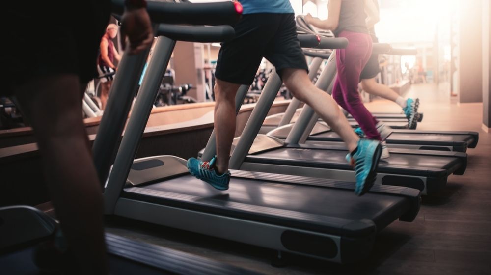 People Running in Machine Treadmill at Fitness Gym Club | New Yorkers Cross State Lines for Workouts | Featured