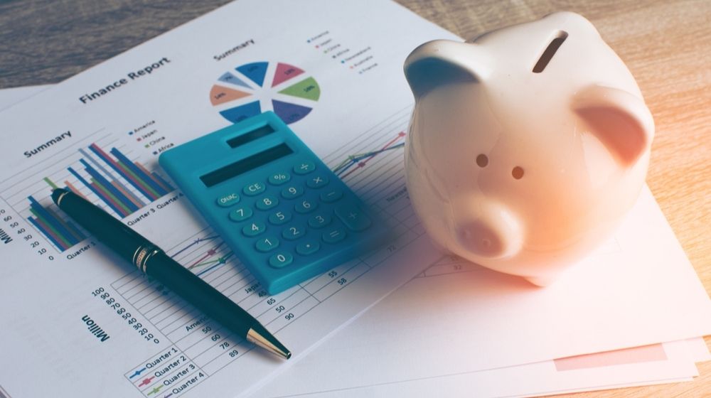 Piggy Bank with Business Stuff | Study Shows That Less Than Half of Americans Are Worried About Money Despite COVID-19 Pandemic | Featured