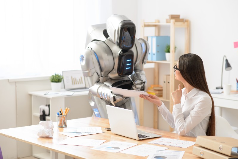 Pleasant girl and robot working in the office | Life With a Robot