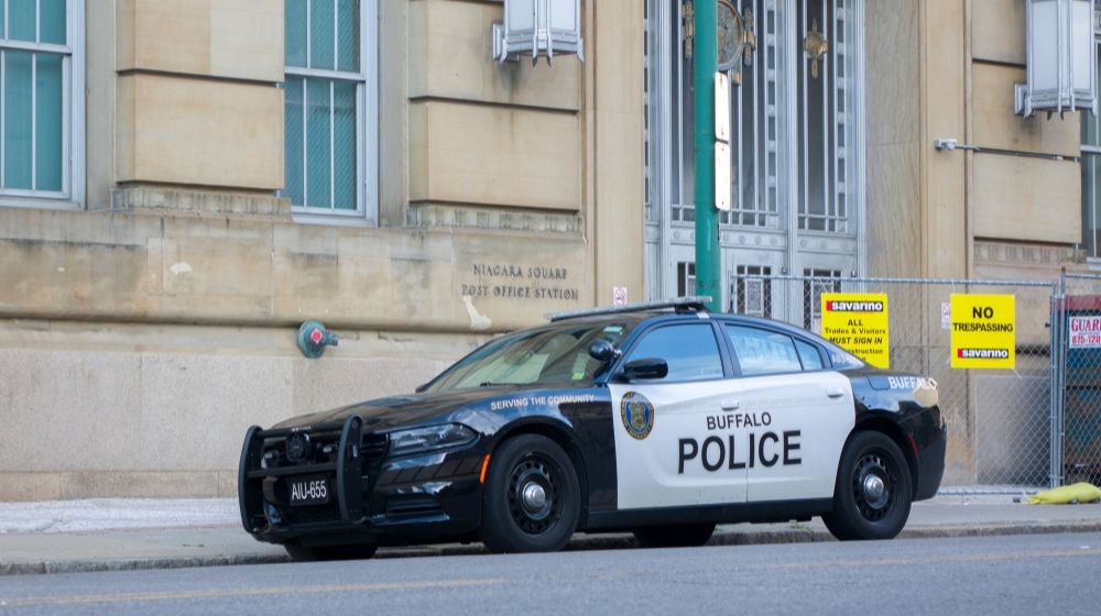 Police Vehicle Parked on the Street | Two Buffalo Police Officers Suspended After Video Shows Elderly Man Falling to the Ground and Bleeding | Featured