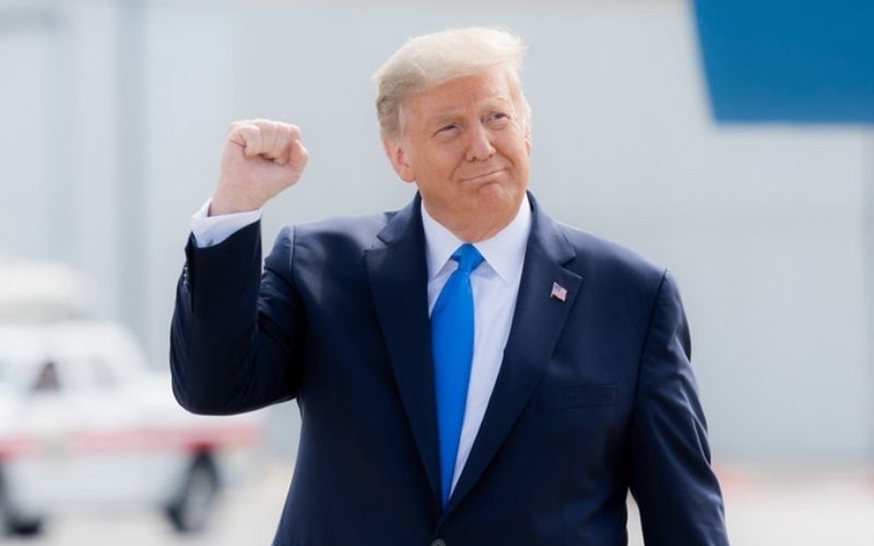 President Donald J. Trump Gestures with a Fist Pump as he Walks | America Chooses Between ‘Dark Winter and Trump