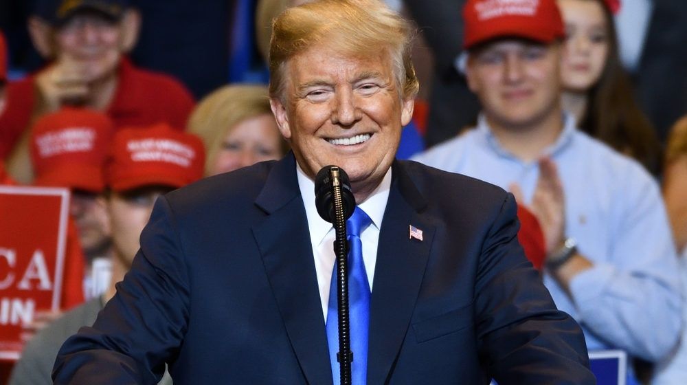 President Donald Trump Portrait Smiling at the Crowd | Trump Supporters March Through NYC with “World’s Biggest Trump Flag”; Chant “Four More Years” | Featured