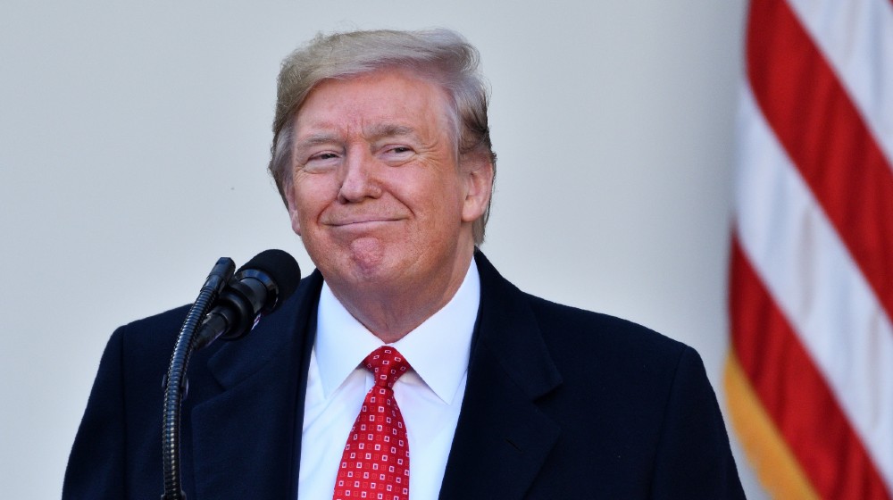 President Donald Trump smiles as he speaks to the crowd assembled at the annual Thanksgiving Turkey Pardon ceremony-Flurry of Pardons-ss-featured
