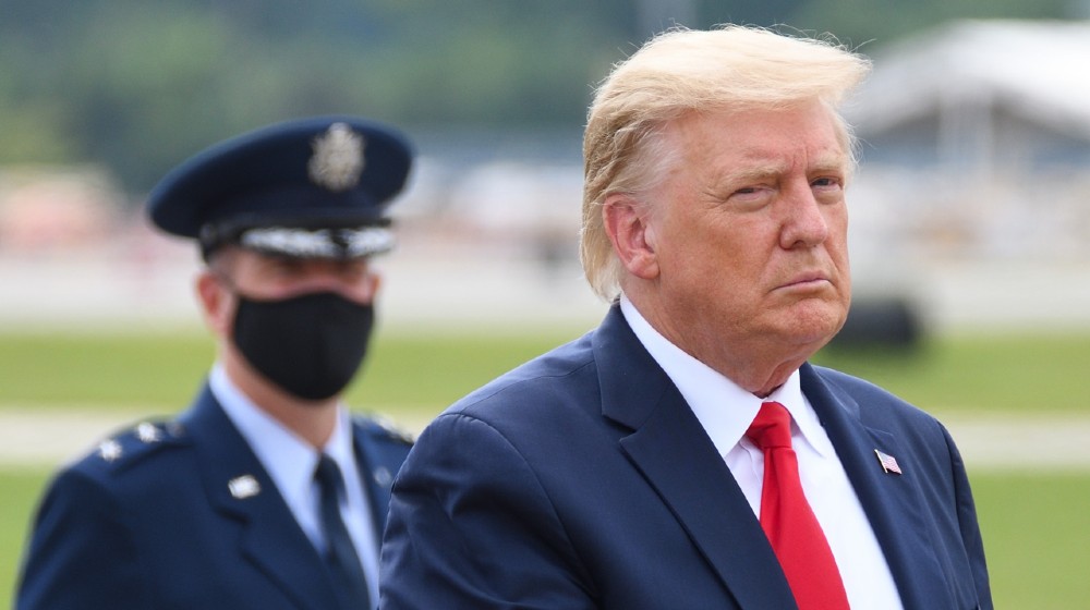 President Donald Trump walks to The Beast limousine | GOP Lawmakers Who Voted Impeach Face Pro-Trump Challengers | featured