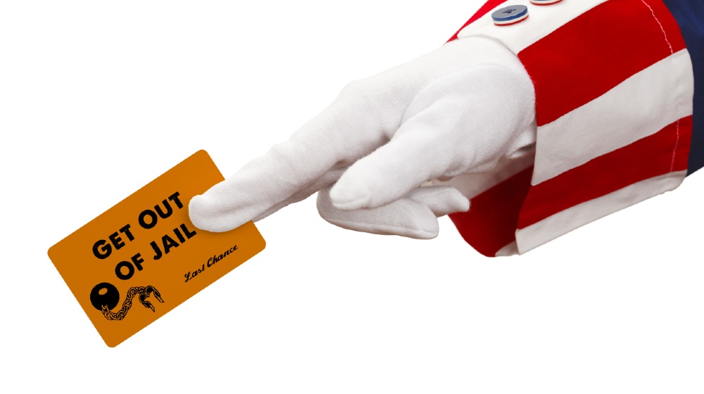 President Holding Get Out of Jail Card Isolated-Bribery For Pardon-ss-featured
