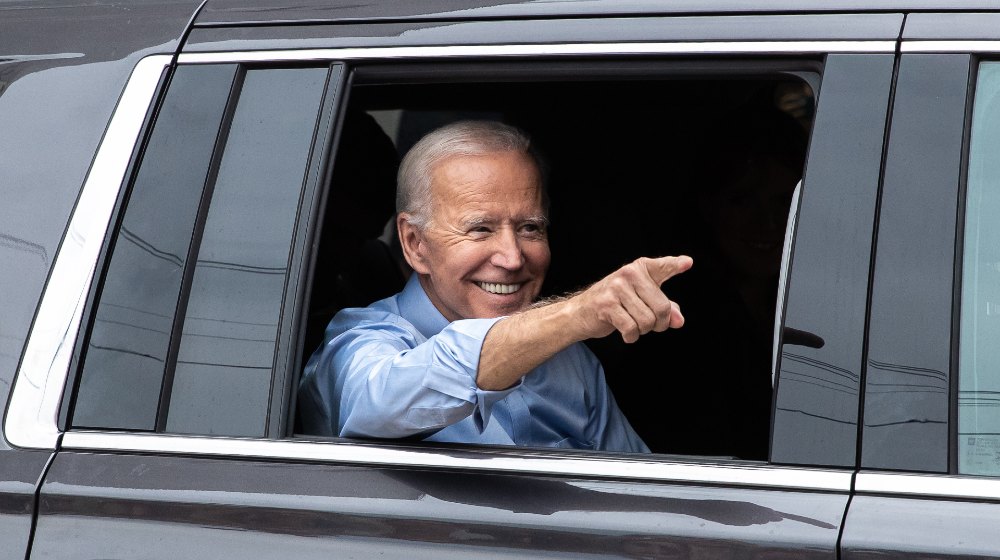 President Joe Biden points to the crowd outside of his first 2020 presidential campaign-Joe Biden-SS-Featured