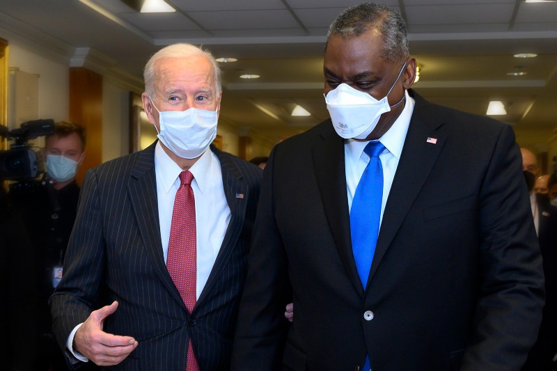 President Joe Biden talks with Secretary of Defense Lloyd J. Austin III during a visit to the Pentagon-Pentagon Leader