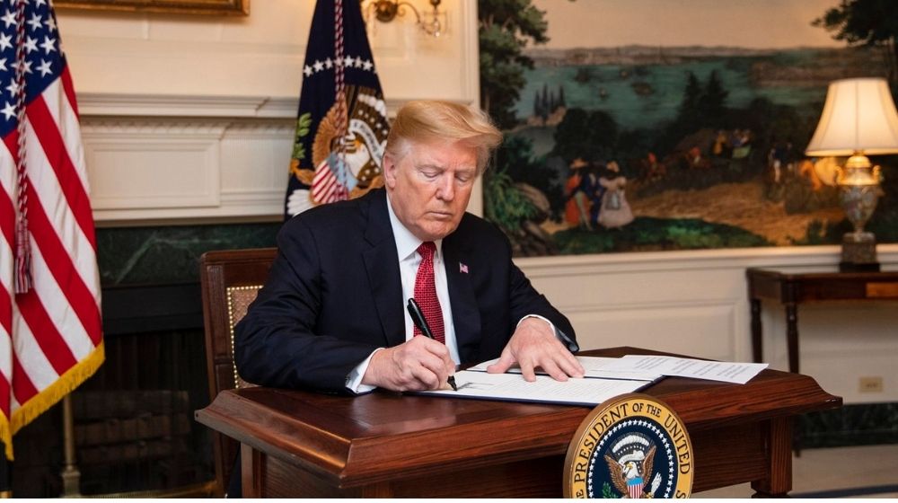 President Donald Trump | Trump Signs Spending Bill to Avoid Government Shutdown | Featured