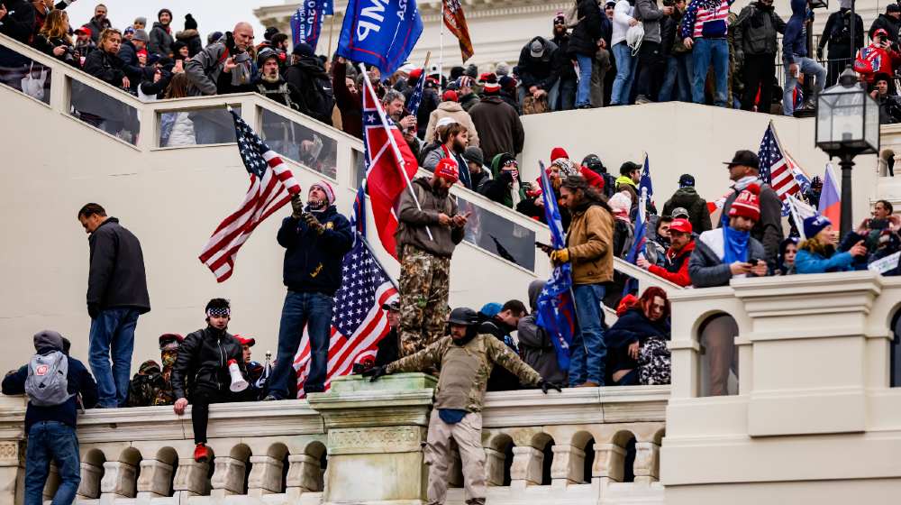 Pro-Trump supporters storm the U.S. Capitol following a rally with President Donald Trump-Trump Concedes-ss-featured