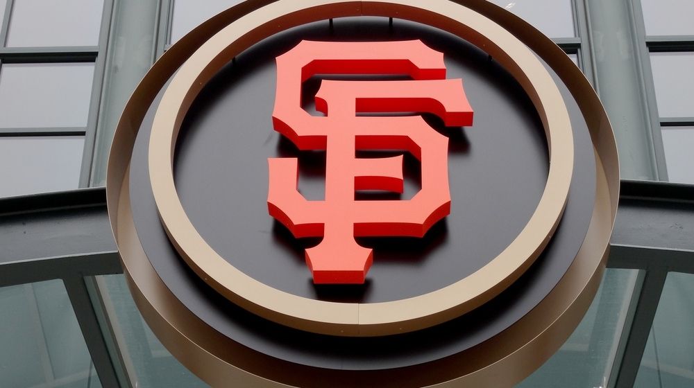 SF Logo During Day at the Entrance of the Ballpark | San Francisco Giants Manager and Several Players Kneel During National Anthem | Featured