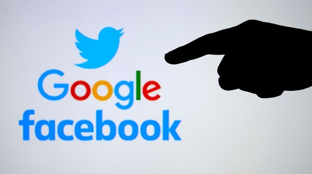 Silhouette of hand pointing to logos of big tech companies-Indiana AG Starts Full Investigation on 5 Big Tech Companies for their Conservative Content Censorship-ss-Featured