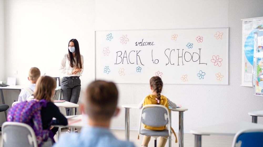 Teacher with Face Mask Welcoming Children Back at School After Lockdown | President Donald J. Trump Is Supporting the Safe Reopening of America's Schools | Featured