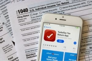The TurboTax Tax Return App icon is seen on an iPhone-TurboTax Customers-SS-Featured