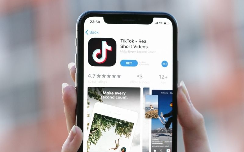 TikTok Application Icon on Apple iPhone X | Trump Hinges TikTok’s Fate on Microsoft or Other Business Deal | Featured