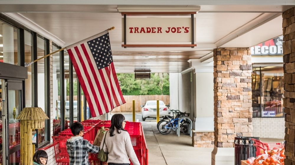 Trader Joes Grocery Store Entrance with Sign | Trader Joe’s Says Its Product Names Aren’t Racist, Won’t Make a Change: Reports | Featured