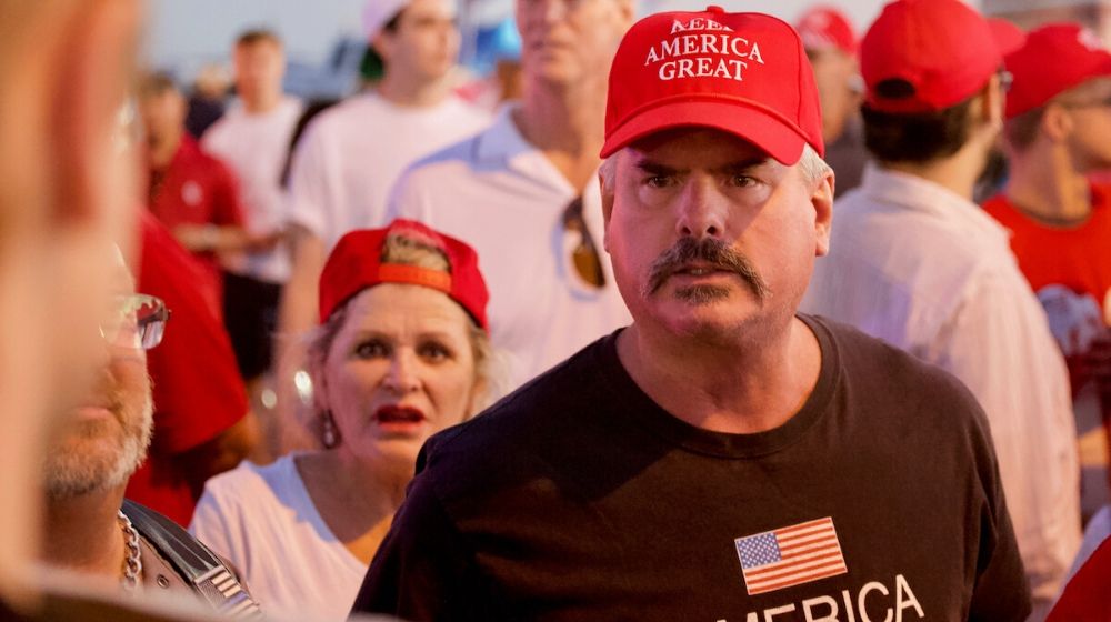 Trump supporters wearing Keep America Great cap | Divisions on Impeachment Reflect Deep American Political Divide | Featured