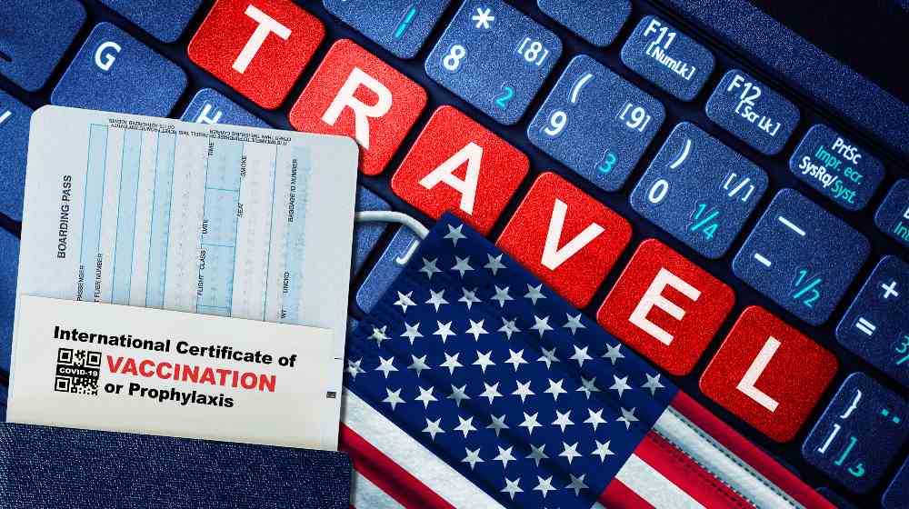 US new normal travel concept with passport, boarding pass, face mask with US flag and certificate of COVID-19 vaccination | US Eases Entry For Fully Vaccinated Foreign Air Travelers | featured