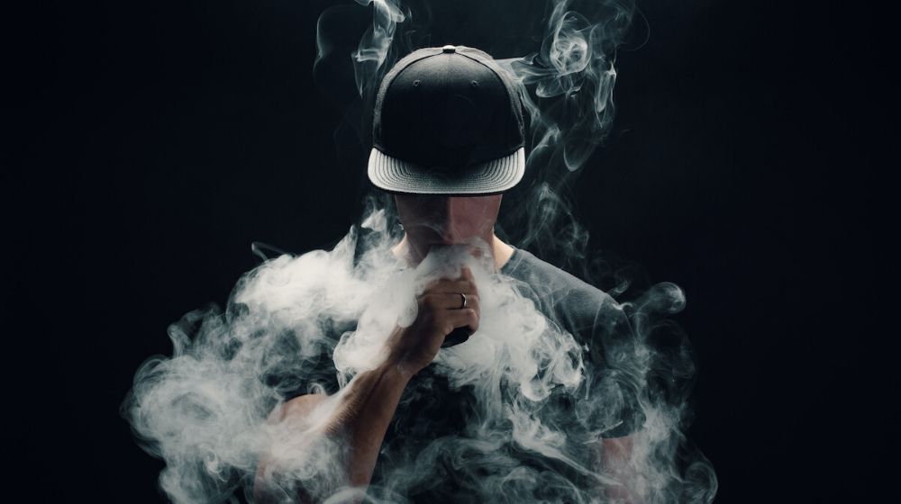 Man covered with vape smoke | Vaping industry Ad Urges Trump to Abandon Flavor Ban Proposal | Featured
