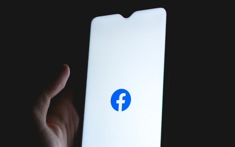 Facebook Logo on Smartphone Screen | Twitter, Facebook Restrict Dissemination of New York Post Story on Biden