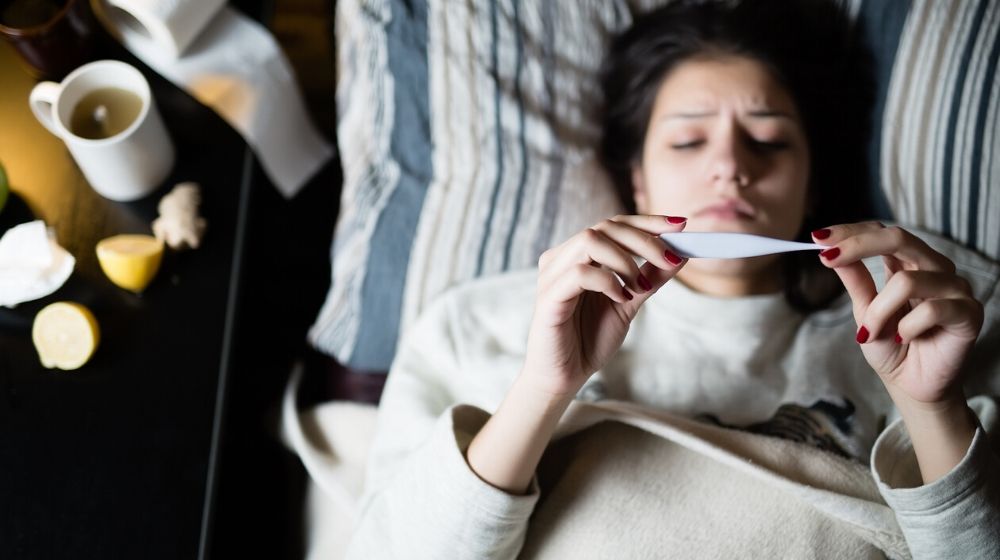 Woman checking her temperature | WORRIED SICK: Countering the Common Cold | Featured