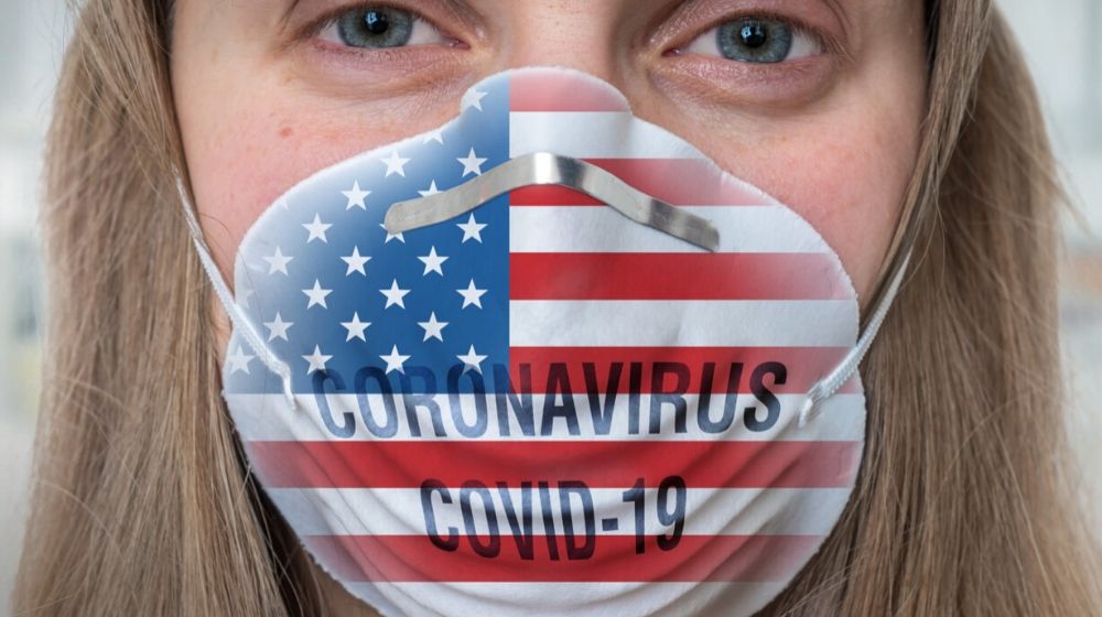 American with US flag mask | U.S. Government Gears Up To Fight Coronavirus | Featured